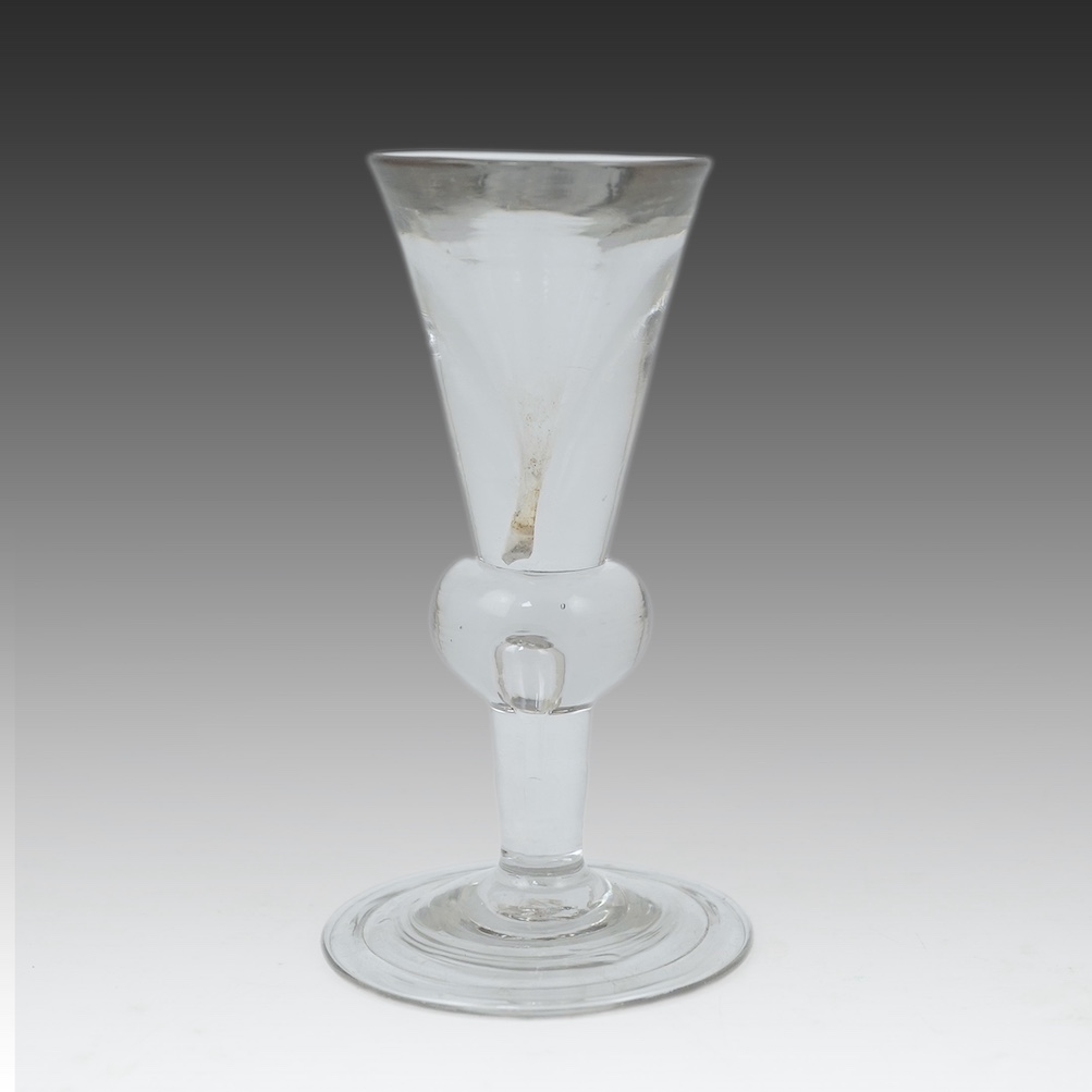 A heavy baluster toastmaster's glass, circa 1715-1720